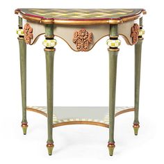 an ornately decorated console table with glass top