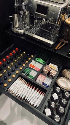 an assortment of coffee and condiments in a drawer