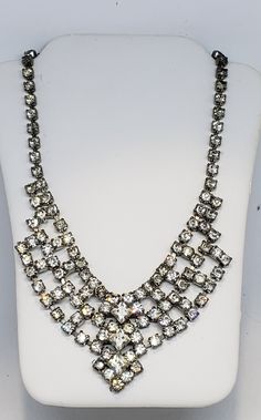 This is a very pretty and fabulous sparkling rhinestone crystal vintage necklace which has well over 100 stones. It's a choker style, it's approx. 15 in. long and has a fish hook style closure which makes it adjustable. It's in very good vintage condition. Enjoy!! REDUCED PRICE: Was $60.00 NOW $50.00 The majority of the jewelry that I have was my grandmothers and she had a lot and loved wearing them all the time. Thank you so much for looking Please check out my other items at my store. I'm new Costume Jewelry Crystal Necklace With Rhinestones, Crystal Rhinestone Costume Necklace, Vintage Crystal Rhinestone Costume Necklace, Crystal Rhinestone Necklace For Vintage Events, Costume Crystal Necklaces With Sparkling Stones, Costume Crystal Necklace With Sparkling Stones, Crystal Costume Jewelry Necklace With Sparkling Stones, Sparkling Crystal Costume Jewelry Necklace, Vintage Rhinestone Crystal Choker Necklace