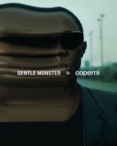 a man with sunglasses on his face and the words gentle monsterer in front of him