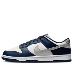 The Nike Dunk Low 'Midnight Navy Smoke Grey' is a stylish sneaker that will make you stand out. Featuring a Sail twill leather base, Midnight Navy smooth leather overlays, and Smoke Grey suede Swoosh, this sneaker is perfect for any occasion. The rubber sole provides extra cushioning and comfort, making it suitable for everyday activities. The inspiration behind the design comes from the classic Nike Dunk series, with a modern twist of navy and white colorway. Get your hands on this timeless classic and make a statement. (SNKR/Skate/Low Top/Non-Slip/Wear-resistant/Shock-absorbing) Grey Nike Dunks, Dunk Low Nike, Shoes 2023, Grey Suede, Grey Nikes, Everyday Activities, Midnight Navy, Nike Dunk Low, Gray Suede