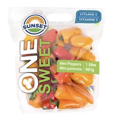 a bag of orange and yellow gummy sweet veggies on a white background