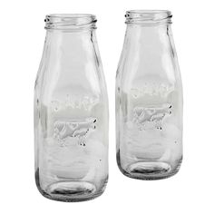 two clear glass jars with an image of a dog on the front and bottom one is empty