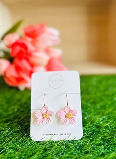 These enchanting pink hibiscus flower hoop earrings are individually colored by hand. Vibrant and elegant, these earrings are perfect for summer, weddings, or any occasion that you want to bring a touch of warm weather to. Handcrafted from lightweight polymer clay and set on a hypoallergenic, nickel-free 20 mm gold hoop.  As with all handmade items, small imperfections, variations in color and size are possible. This is inherent to the nature and charm of handmade items. However, I do my best to be consistent in my work. See my full range of earrings here: https://klaykreationsshop.etsy.com Follow me on Instagram or Facebook for behind the scenes looks, sneak peeks of upcoming collections, and more! Instagram: @klay.kreations.shop  Facebook: Klay Kreations Shop Pink Flower Earrings For Beach, Hibiscus Clay Earrings, Polymer Clay Hibiscus, Handmade Bohemian Pink Flower Earrings, Pink Hibiscus Flower, Pink Resin Flower-shaped Earrings, Hoop Dangle Earrings, Pink Hibiscus, Tropical Summer