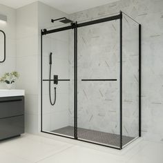 a bathroom with a walk in shower next to a white sink and mirror on the wall