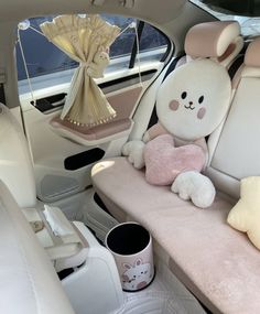 there is a stuffed bunny sitting in the back seat