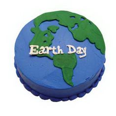 a blue and green earth cake with the words earth day on it's side