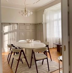 a white table and chairs in a room