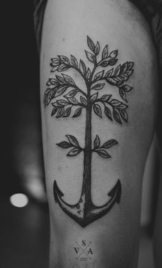 an anchor tattoo on the thigh