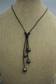 "Necklace is 13'' to 30'' long( the necklace length is not include drop part) Leather is 2 mm thick. Baroque pearl size is approximately 9-12mm front 4 tahitian pearl, back clasp one freshwater pearl. quantity: 1 pc pearl luster:high luster pearl body: AA+ pearl shape: baroque pearl size: approx 10-12mm pearl color: tahitian black color Back to Other Jewelry Section 01: \"Tahitian,Akoya,Sea Pearl\" Section: https://www.etsy.com/shop/WenPearls?section_id=15806339 02: \"Potato/Near Round Pearl\" S Leather Pearl Jewelry, Leather Pearl Necklace, Black Pearl Necklace, Tahitian Black Pearls, Big Pearl, Leather Ring, Pearl Leather, Sea Pearl, Sea Pearls