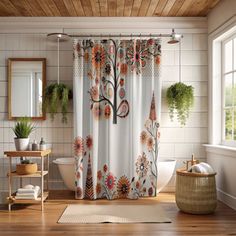 a bathroom with a shower curtain, rug and mirror on the floor in front of it