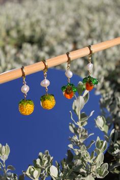 These adorable earrings are handcrafted with love and care. They are hypoallergenic and tarnish-resistant, making them perfect for everyday wear.  M A T E R I A L S  &  S I Z E - Overall Size: Round hoop 14 mm - Total length: .5" - 1.5" - Metal: Gold Plated Unique Handmade Jewelry, Persimmon, Cute Food, Cute Earrings, Austin Tx, S S, Jewelry Earrings Dangle, Austin, Dangle Drop Earrings