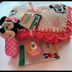 a minnie mouse blanket and other items on a table