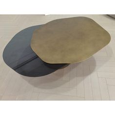 two tables sitting on top of each other in the middle of a flooring area