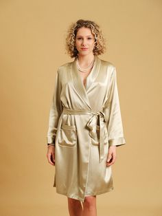 Indulge in the luxurious Pure Silk Robe, a sublime addition to your daily routine. This mid length robe with fixed belt gives you timeless elegance and perfect for wear for all occasions, whether it's for a romantic evening at home, a spa day, or just to elevate your everyday routine, our Pure Silk Robe will become your choice.  It also makes for an exquisite gift for a loved one. - Pure Mulberry Silk - Long Sleeves - Fixed belt, never gone missing! - Shaw Collar - 2 Front Pockets Note: Actual c Elegant Belted Kimono, Elegant Wrap Kimono With Belt, Elegant Belted Wrap Kimono, Elegant Gold Kimono For Wedding, Elegant Long Sleeve Gold Robe, Elegant Gold Robe, Romantic Evening At Home, Silk Long Sleeve Blouse, Silk Gifts