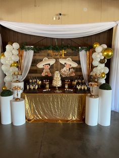 a table topped with lots of desserts and balloons