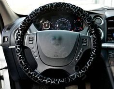 the steering wheel cover is decorated with black leopard print