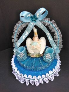 a blue and white cake with a baby in it