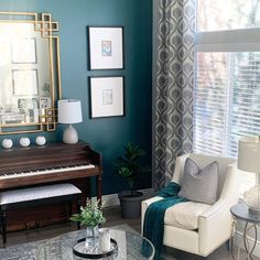 a living room filled with furniture and a piano in front of a window covered in curtains