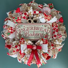 a gingerbread bakery christmas wreath hanging on the wall