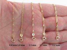 "Fabulous Shiny 10k Yellow Gold Singapore Chain!! This  Shiny and sparkly chain is hand crafted of Real solid gold and it's a perfect chain for your pendant and it can be worn or layered with you other everyday chains. Material: 10k gold , Stamped on the clasp Thickness: 0.8 mm , This chain is thin This chain comes with round spring clasp Length and avg weight: 16\" = 0.6  g 18\" = 0.7  g Thickness: 1.0 mm This chain comes with round spring clasp Length and avg weight: 16\" = 0.8  g 18\" = 0.9 Gold Chain For Women, Rope Chain Necklace, Chain For Women, Chain Ring, Star Necklace, Rope Chain, 10k Gold, Chain Styles, Spring Rings