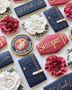 decorated cookies are displayed on a table with the words semperfit spelled in red, white and blue