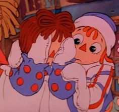 an animated image of two children hugging each other in the middle of a cartoon scene