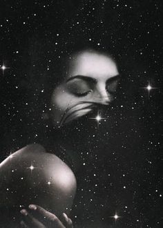 a woman with her eyes closed and stars in the sky behind her is an image of a person's face