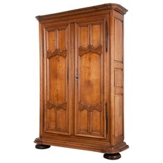 an old wooden armoire on wheels against a white background