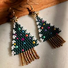 Christmas tree beaded earrings made with a mixture of seed beads and topped with rhinestone studded metal star beads Christmas Tree Beads, Star Beads, Metal Star, Beaded Crafts, Metal Stars, Jewelry Design Earrings, Creating Jewelry, Rhinestone Studs, Christmas Earrings