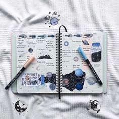 an open notebook with various items on it