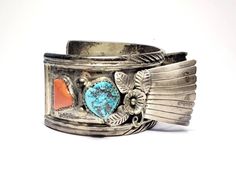 "Men Turquoise Watch Cuff Dine Jerry Roan Vintage Sterling Coral Turquoise Navajo Watch Vintage 1970s Dine Jerry Roan sterling silver, turquoise & coral watch cuff bracelet with amazing flower, leaf and stamp work with high fan sides flanking the watch space. \"New\" vintage stock, never used. Measures 7\" inside circumference including the 1 1/2\" gap by 1 1/4\" wide. The fans sit 3/4\" tall. Navajo tribal native Jerry Roan (1919-1977) had a productive life as a silversmith and jewelry maker. H Turquoise Watch, Productive Life, Cuff Watch, Watch Vintage, Flower Leaf, Coral Turquoise, Jewelry Maker, Amazing Flowers, New Vintage