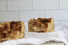 two pieces of cake sitting on top of a white napkin