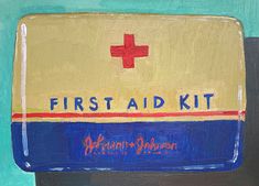 the first aid kit is painted in blue, yellow and red with a cross on it