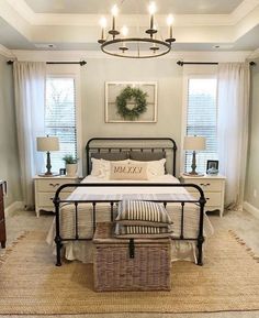 a bed room with a neatly made bed and a basket on the floor next to it