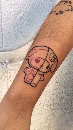 a small tattoo on the arm of a person with an elephant and heart in it