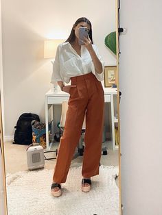 Rust Colored Wide Leg Pants Outfit, Terracotta Pants Outfit, Flowy Brown Pants Outfit, Burnt Orange Trousers Outfit, Burnt Orange Pants Outfit Work, Terracotta Pants Outfits, Orange Trousers Outfit, Ceo Wardrobe, Camel Pants Outfit