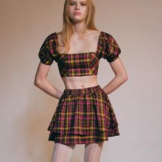 New With Tags. Plaid Top And Skirt Set From Uo. Top Is Cropped Above The Waist With A Straight Neckline And Puff Sleeves. Skirt Is High-Rise With A Tiered Hem. - 66% Polyester, 32% Viscose, 2% Spandex Y2k Fitted Tiered Mini Skirt, Y2k Tiered Mini Skirt For Summer, Fitted Mini Skort In 90s Style, Fitted 90s Style Mini Skort, Fitted 90s Style Mini Skirt For Summer, 90s Fitted Mini Skirt For Spring, 90s Style Fitted Mini Skirt For Spring, 90s Style Mini Skort For Summer, 90s Style Mini Skirt For Summer