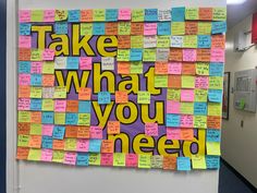 a bulletin board covered in post - it notes with the words take what you need