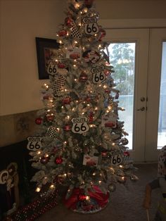 a white christmas tree with cars and numbers on it