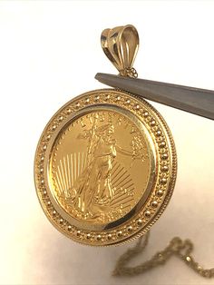 * Designer AE 14K Yellow Gold 1/10 Oz Fine $5 Gold Coin Round Pendant Necklace * Length: 31" * Pendant length including bale: 1-3/16" * Pendant width: 7/8" * Coin measures: 16.57mm round * Pendant is marked: 14K * AE  * Chain is marked: 14KT * AE  * Coin is marked: 2016 * Liberty * 1/10 oz. Fine Gold * 5 Dollars * MB * JW * Weight: 5.7 tgw * Closure: Lobster * Condition: As pictured. * G3992    Exported By ExportYourStore :) 5 Dollar, 5 Dollars, Round Pendant Necklace, Gold Coin, Gold Coins, Round Pendant, Favorite Jewelry, Necklace Etsy, Jewelry Necklace Pendant