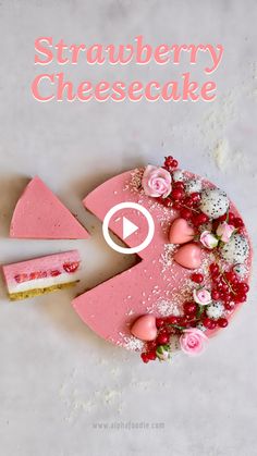 a cake with pink frosting and flowers on it sitting on a white counter top