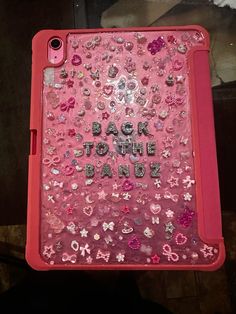 the back to the band case is covered in pink sequins and lots of jewels