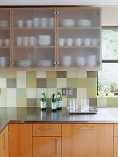 a kitchen with wooden cabinets and stainless steel counter tops