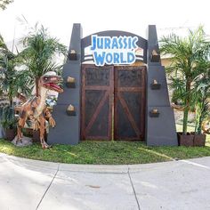 an entrance to a dinosaur theme park