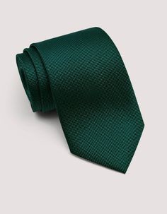 This self print designer tie has a rich, sophisticated hunter green color that complements a variety of other colors. You can wear it with navy, brown, grey, or even khaki for a more casual look. It also pairs well with patterned shirts. This silk tie in self print works well year-round. It can add a touch of color to darker winter outfits and looks cool and crisp in the summer. You can wear this tie to a variety of occasions, from business meetings to weddings. 100% silk 100% polyester lining 8 Hunter Green Color, Patterned Shirts, Designer Ties, Tie Gifts, Tie Accessories, Green Silk, Look Plus, Suit And Tie, Hunter Green