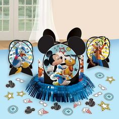 mickey mouse party supplies including plates and napkins