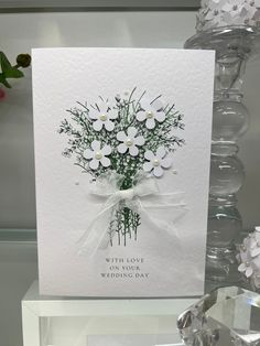 a greeting card with white flowers on it