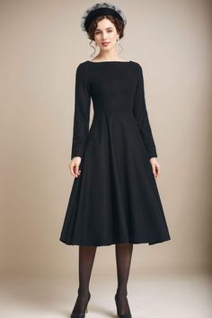 This gorgeous black fitted waist dress is perfect for the office or a night out! Wear with heels, sandals, tights or leggings and boots. Or dress it up with statement necklace and heels. This dress will fit in autumn season or winter. Details: * 35% wool blend, 35% fiber and polyester, 30% nylon * Polyester lining * Right side zipper * two side seam pockets *Midi dress, Long wool dress * boat neckline * long sleeves wool dress * A-line wool dress *Perfect for winter or autumn *Machine Washable in Warm/Cold Water/Do not bleach /Mid-iron /Hang Dry MODEL SIZE Height 170 cm (5′7″) Bust 80 cm (31.5") Waist 66 cm (26") She is wearing the black wool dress in size XS. CUSTOM ORDER Can't find your size in our size Chart Chang the Length Your Height is not Between 5'1" - 5"9" Your weight is not Betw Classic Evening Midi Dress For Winter, Classic Winter Midi Dress For Office, Fitted Black Wool Dress, Black Fitted Wool Dress, Classic Winter Office Midi Dress, Black Wool Dress For Formal Occasions, Black Wool Dress For Winter, Black Wool Dress For Evening, Black Wool Evening Dress