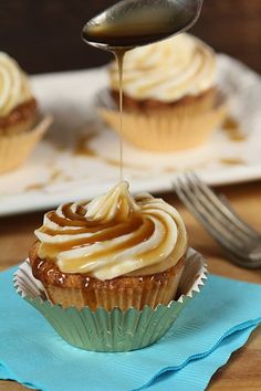 cupcakes with icing being drizzled on top